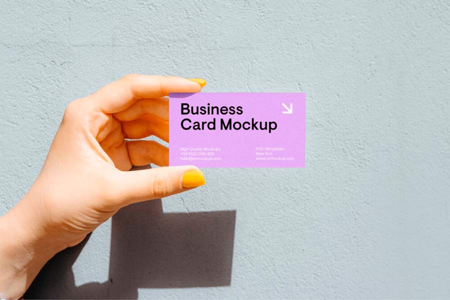 Business Card in Women Hand Mockup