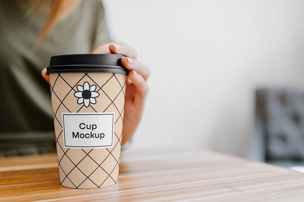 Coffee Cup with Hand Mockup