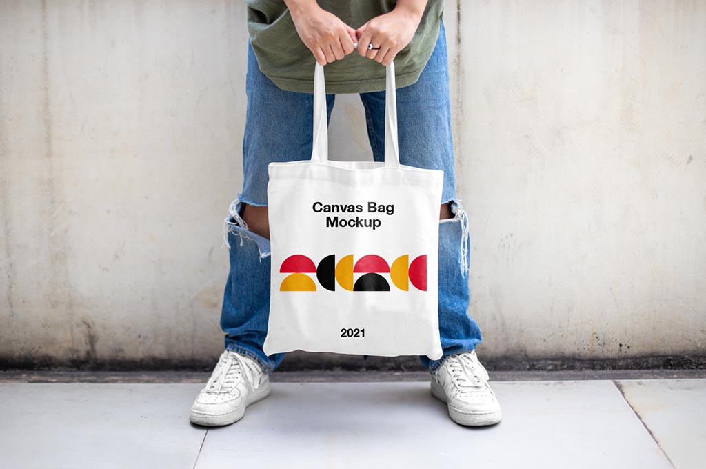 Man Holding Canvas Bag Mockup